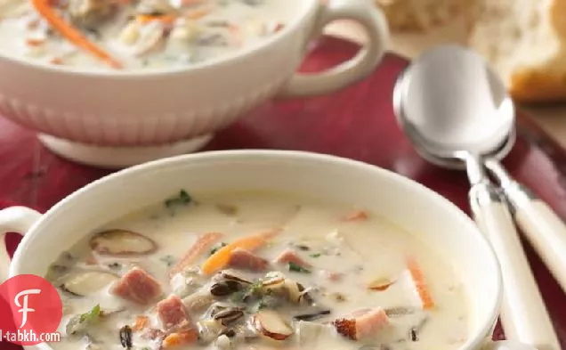 لحم خنزير كريمي بطيء الطهي وحساء أرز بري