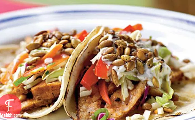 سندويشات التاكو لحم الخنزير مع سلو وبيبيتاس حار